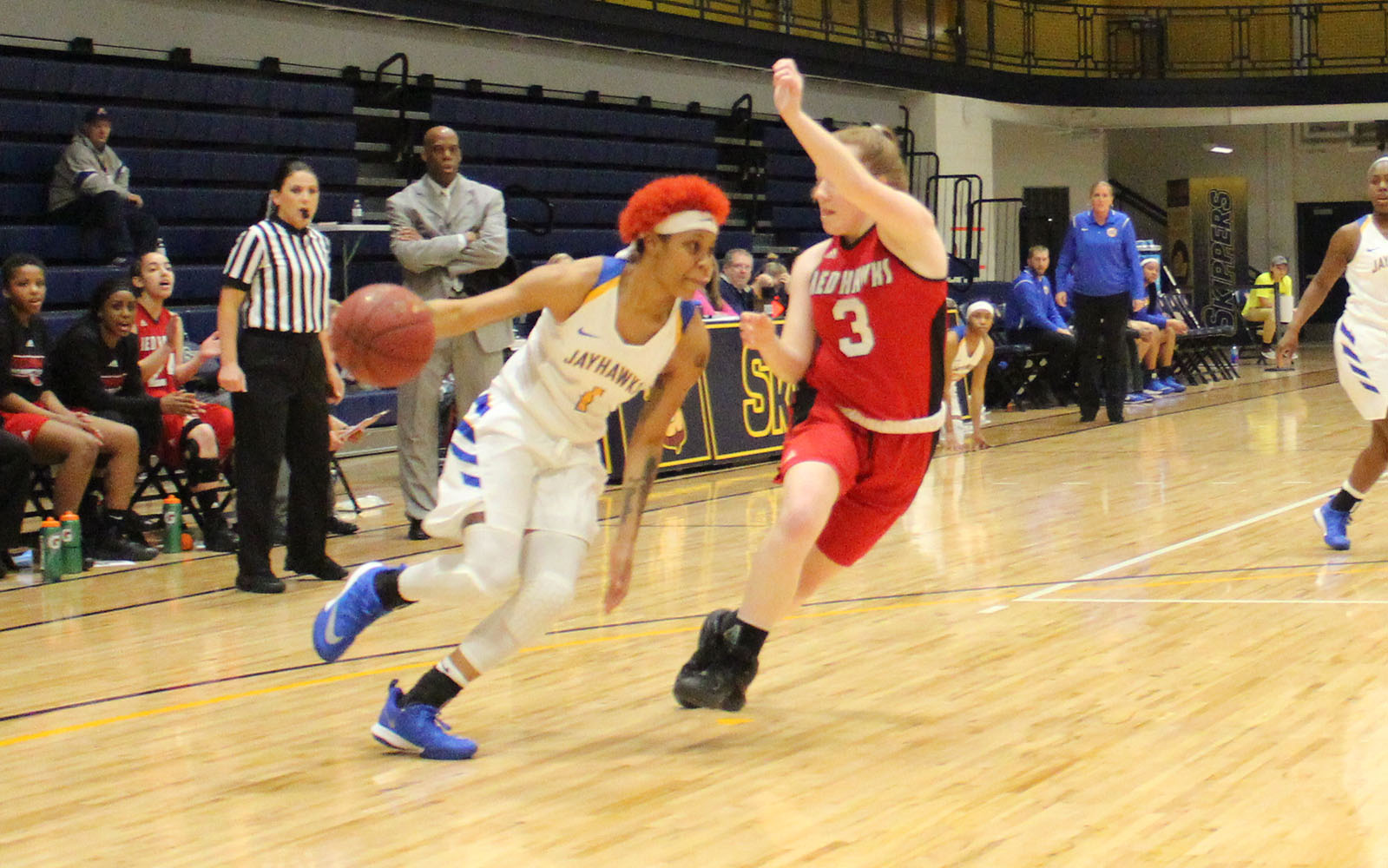 Muskegon CC women's basketball player drives to the hoop against Lake Michigan College