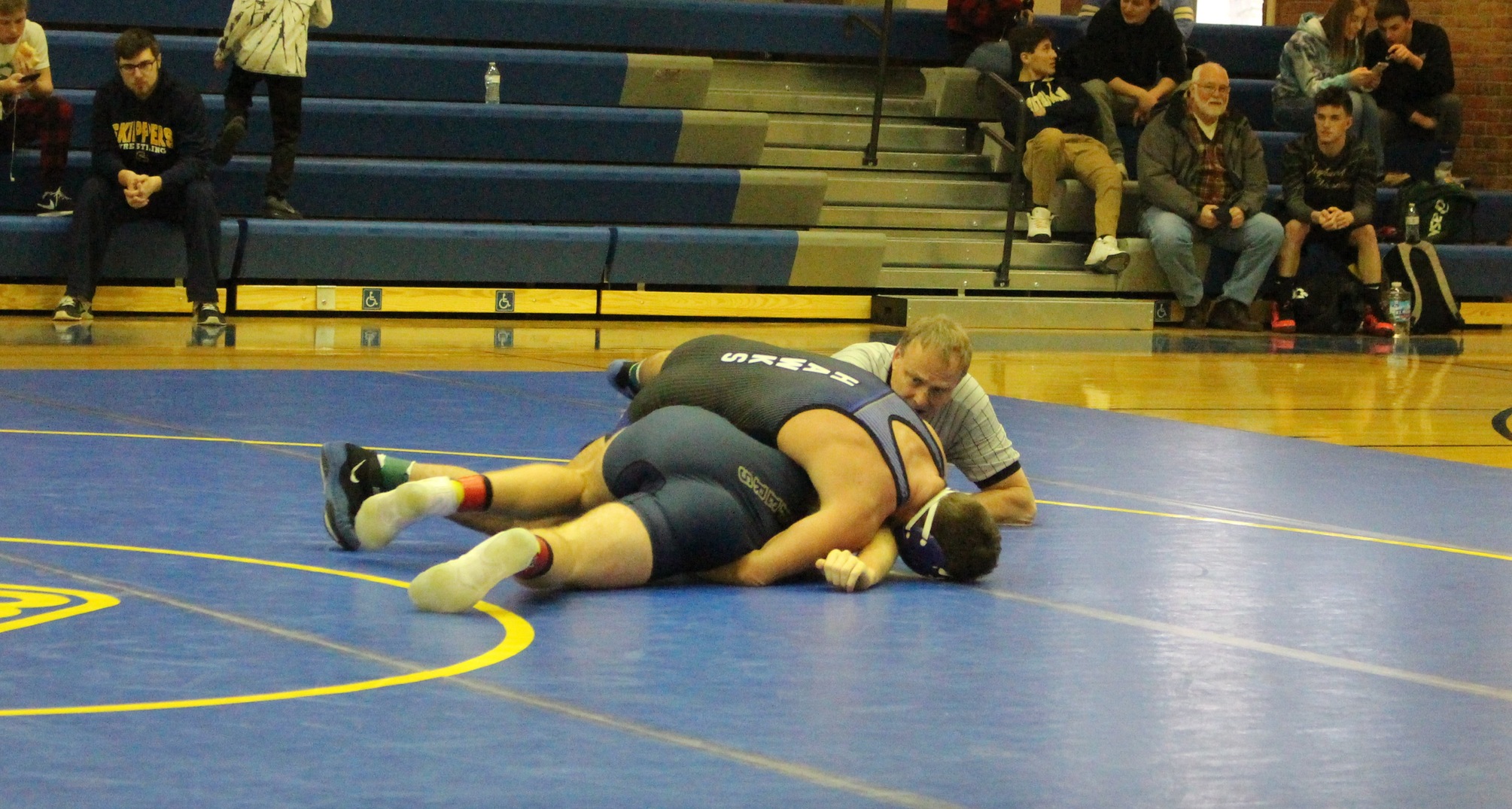 Henry Ford wrestles a St. Clair County CC wrestler.