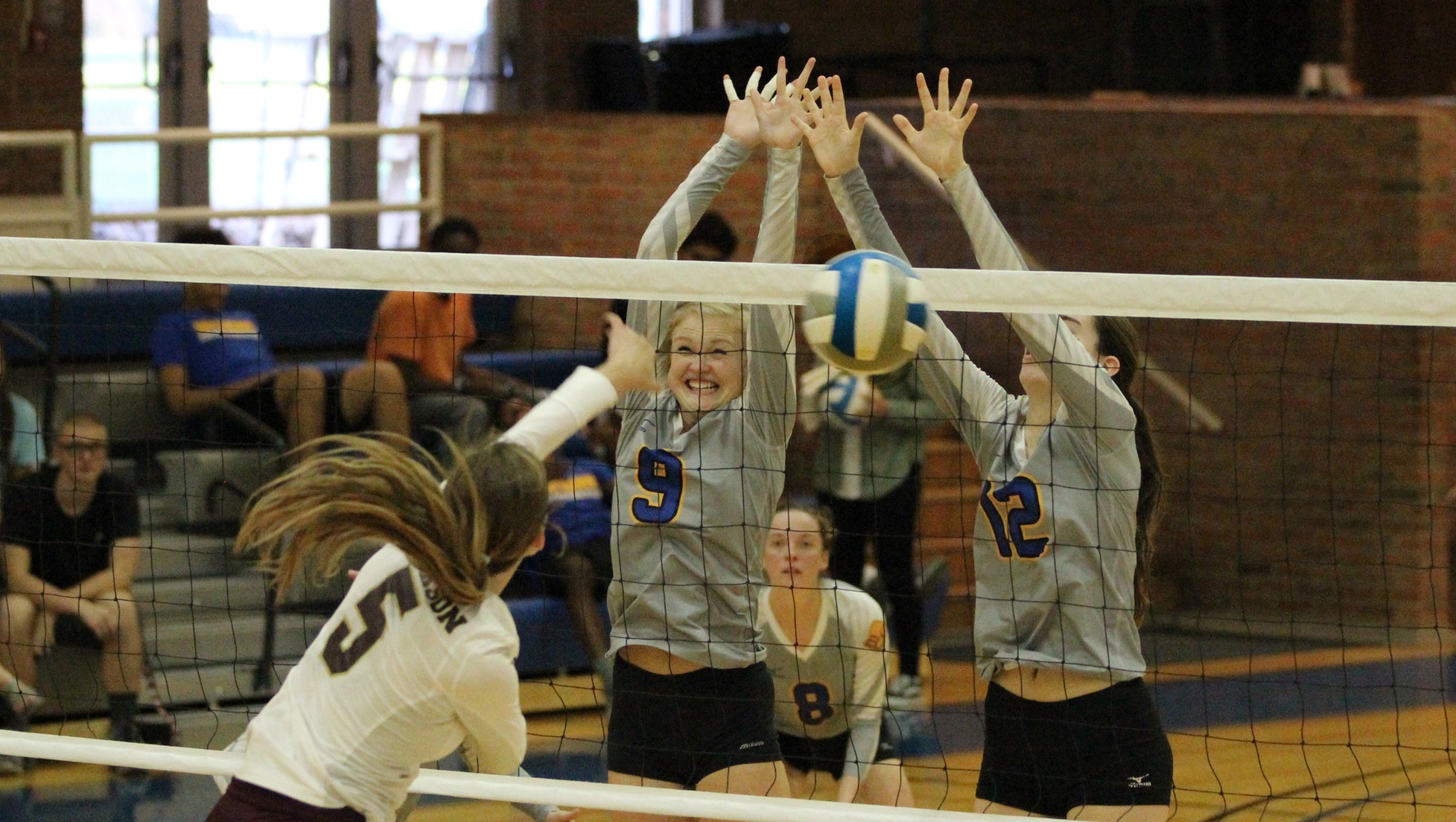 Muskegon Community College's Middie Heiss and Amber Jacobs try to block Jackson College's Camryn Ward. 
Photo: Muskegon Community College